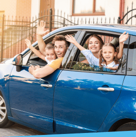 People smiling in car