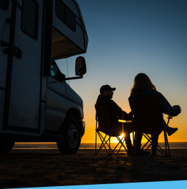 Image of people relaxing by RV